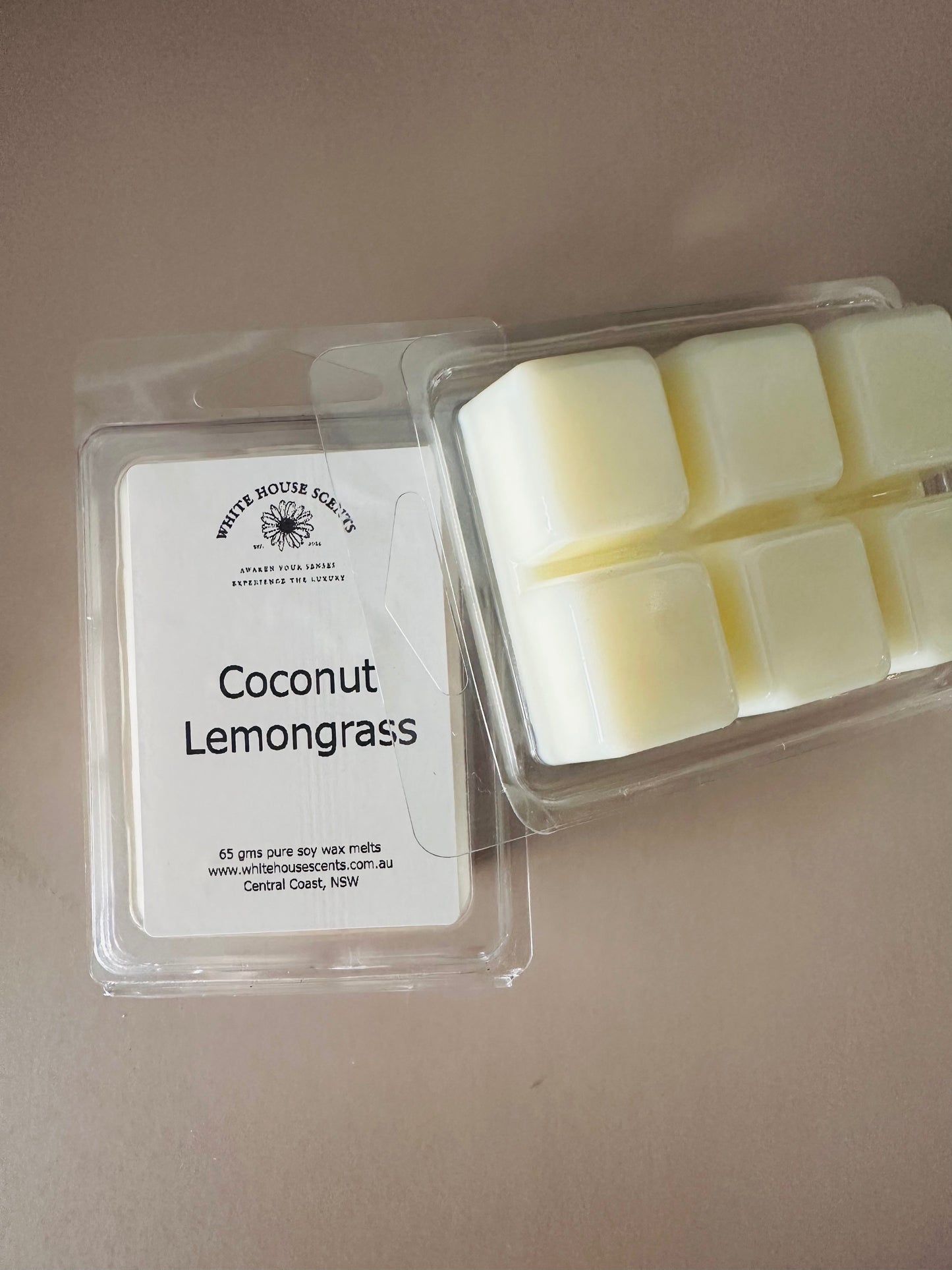 Packaged coconut lemongrass wax melts on a neutral background