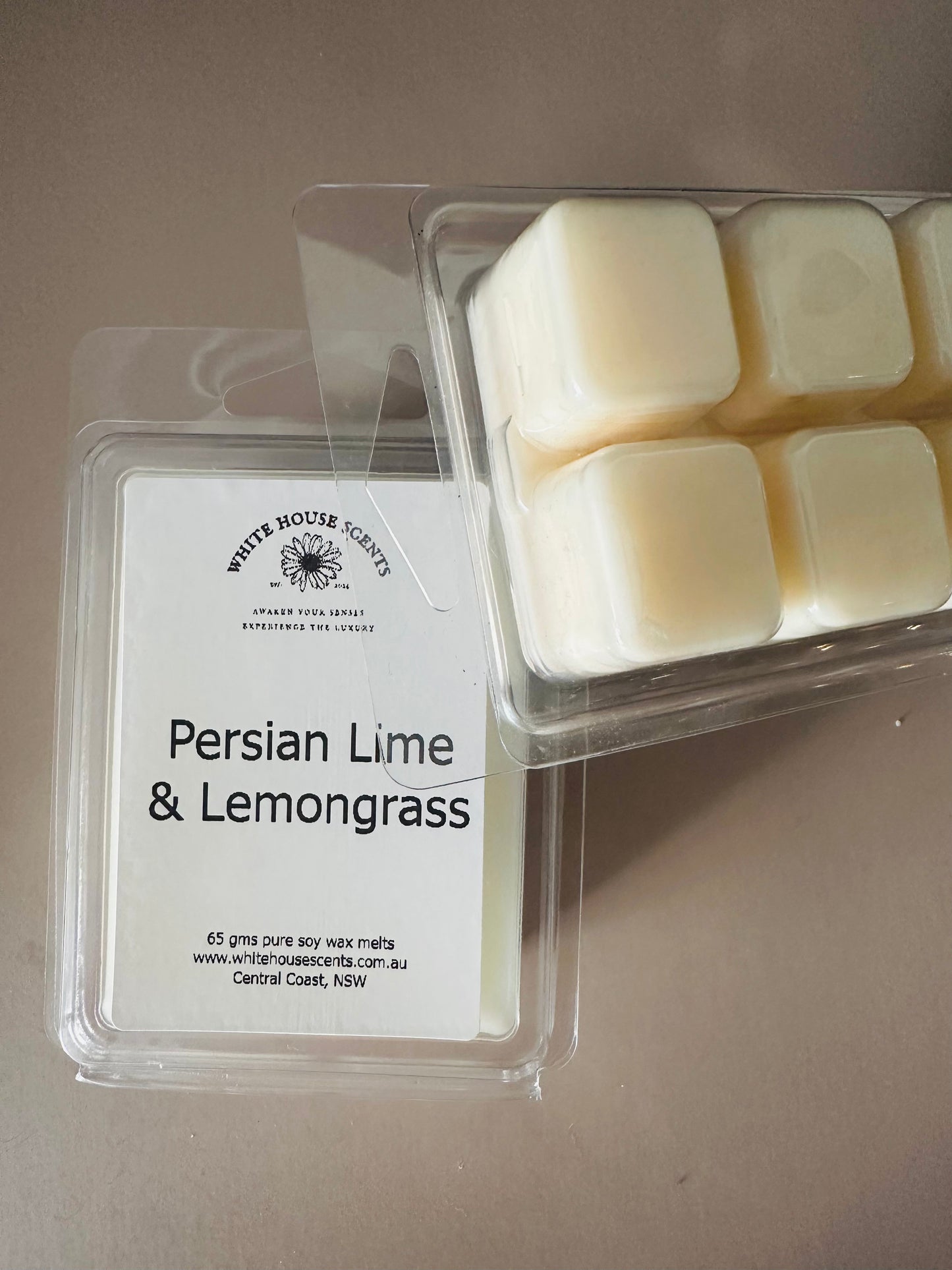 White House Scents Persian Lime & Lemongrass wax melts packaging on a neutral background